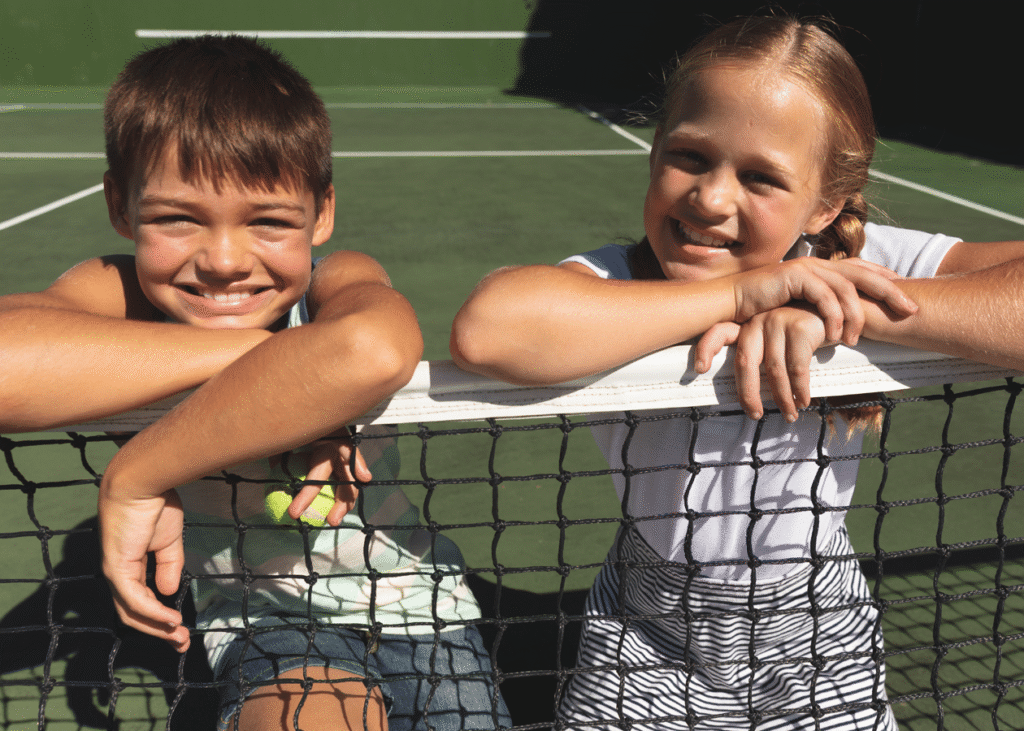Kids playing tennis on a RacFit Foundation court